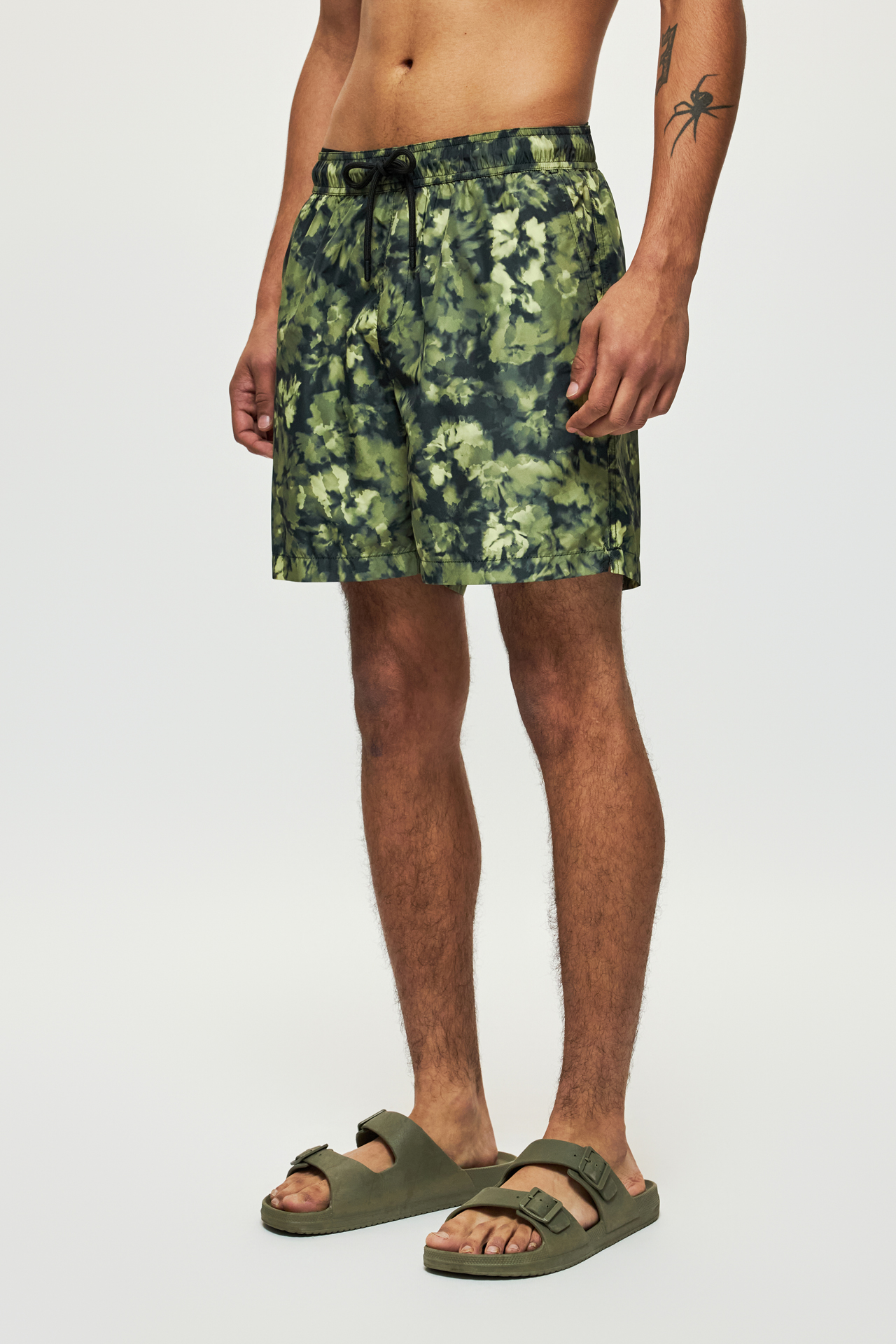 THE CAMOUFLAGE SWIM TRUNKS